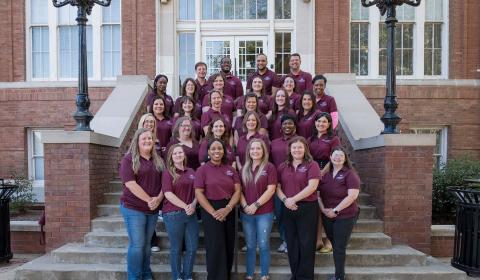 Group photo of Staff Council representatives on the steps of Lee Hall Oct. 14, 2026